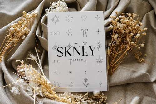 Tatouage temporaire papillons et plumes SKNLY - Collection Ailes